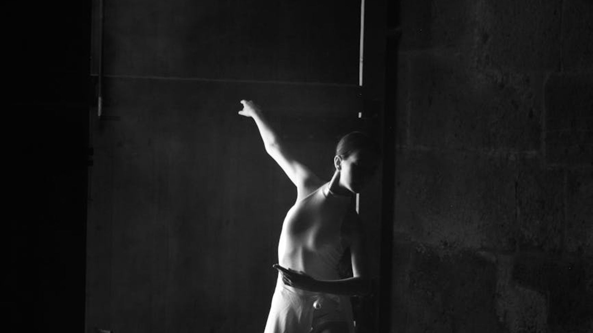 Dark, atmospheric training space with subtle light accents.